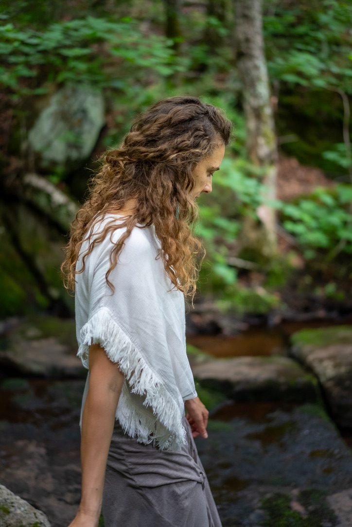 Robyn from behind, walking into the forest